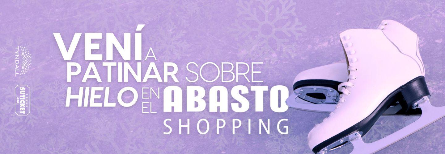 Banner with purple background showing text: TOBOGAN DE HIELO EN EL ABASTO SHOPPING next to white ice skates on the right